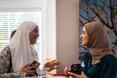 Two event attendees conversating.